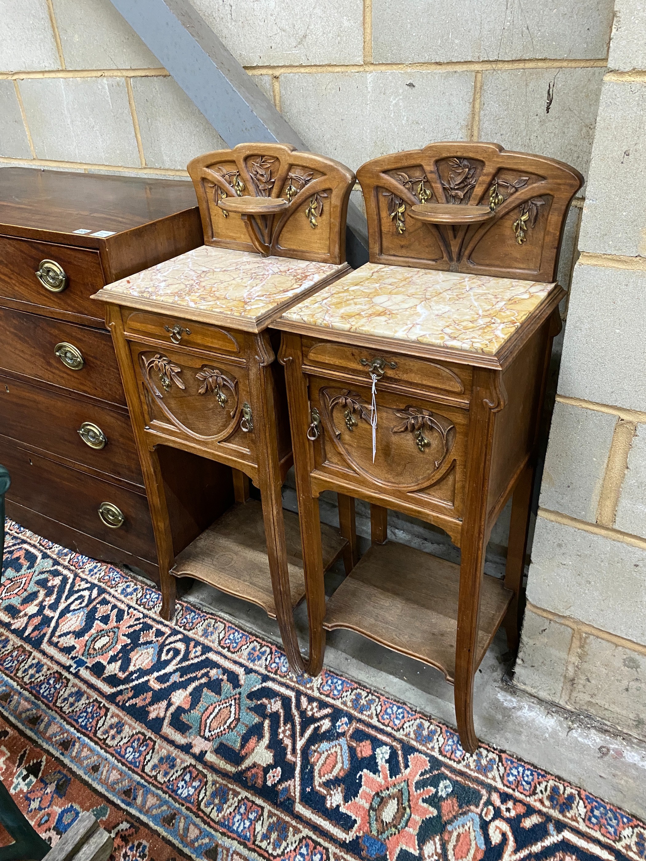 A pair of French Art Nouveau marble topped bedside cabinets, width 38cm, depth 32cm, height 107cm